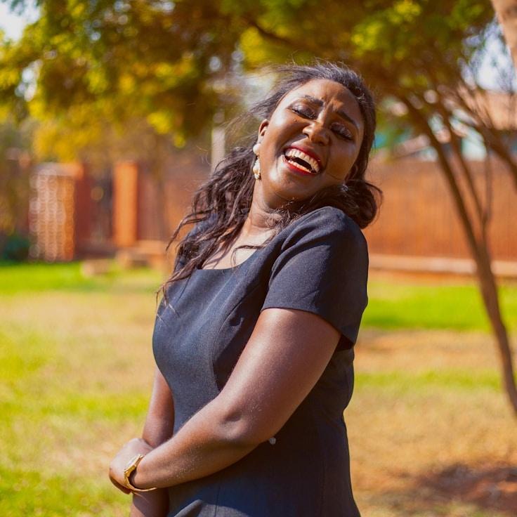 Ava Singh, Lead Design Curator at Pale Orchid Trail, reviewing corporate floral arrangements